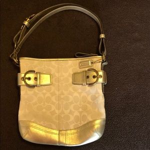 White Coach bag with gold leather trim